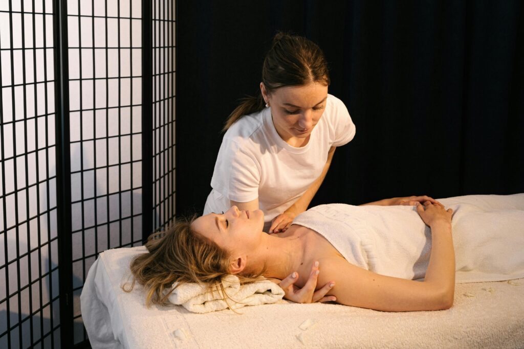 A masseuse giving Postnatal Massage Service to a client.